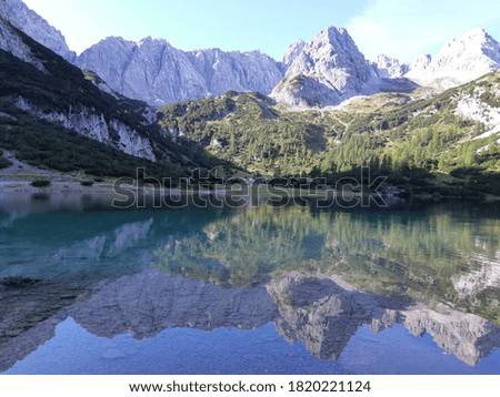 Reflection in the Seebensee in Tirol, Austria. Mount Dragon, Ehrwald
