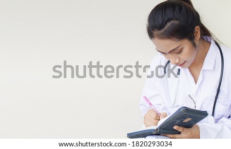 Medical physician doctor woman, Young doing a record in book concept.                                