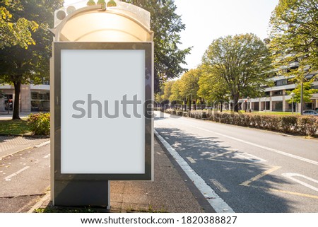 Blank billboard mock up in a bus stop, in the street