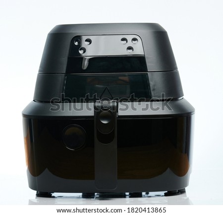 Black air frier machine isolated on white studio background Royalty-Free Stock Photo #1820413865