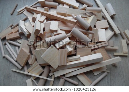 Wood work parts . Scrap woods : round timbers and building bricks . Handicraft work material . Wood Blocks and creative material for crafting .