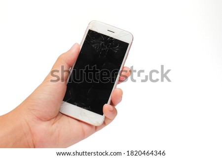 Broken screen of smartphone in hand isolate on white background