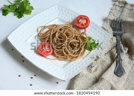spaghetti made from buckwheat on a white table
