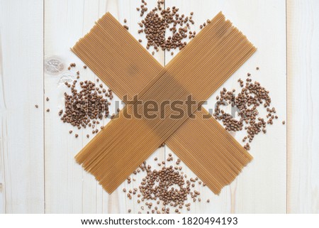 spaghetti made from buckwheat on a wooden table