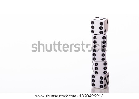 end to end Stack of five white dice black pips showing six isolated on white background copy space