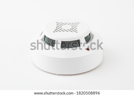 Ceiling smoke detector on a white background