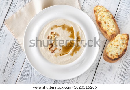 Cauliflower soup with brown butter and cheesy toasts