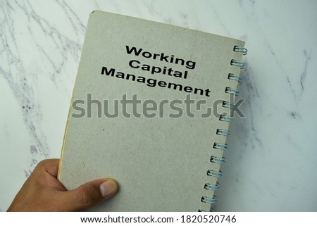 Working Capital Management write on a book isolated on office desk.