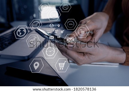 Double exposure of businesswoman working on tablet and laptop computer with digital network online virtual chart, Abstract icon, Business strategy concept, Background toned image blurred.