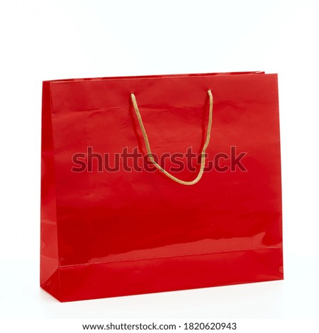 Black friday Red paper shopping bag isolated on white