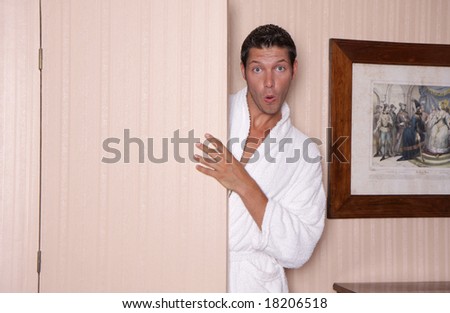 Man beeing surprised while opening a door