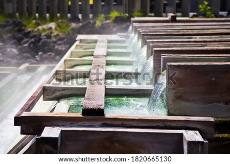 Yubatake onsen, hot spring wooden boxes with mineral water in Kusatsu onsen, Gunma prefecture, Japan.