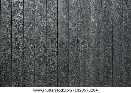 Burnt wooden board texture. Yakisugi is a traditional Japanese method of wood preservation Royalty-Free Stock Photo #1820673284