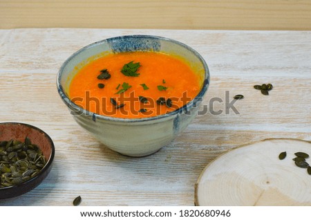 Autumn delicious healthy food, hearty pumpkin soup top view, healthy nutrition on autumn dinner, the concept of thanksgiving day