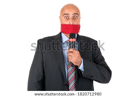 Gagged businessman with a microphone isolated in white Royalty-Free Stock Photo #1820712980