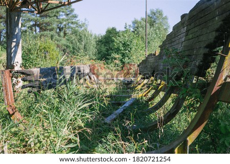 Old abandoned wooden bobsleigh track in summer by daylight