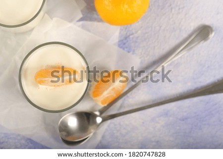 homemade yogurt in glass glasses with berries and fruit