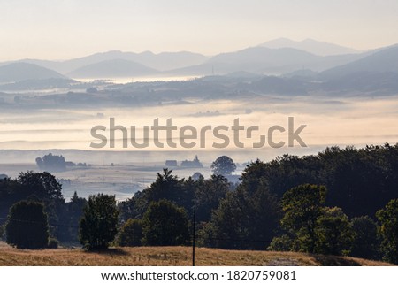 Sunrise in mountain view on valley in sunrise with fog and mountain layers on Durmitor mountain in Montenegro
