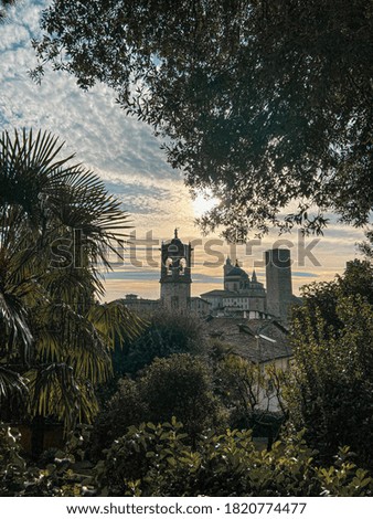 Bergamo city - Scenic sunset view of the Old city from the walls of the upper city. Travel paradise destination. Background picture.
