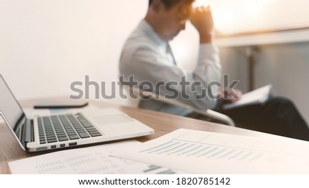 Stressed mature businessman suffering headache at office, Selected focus.