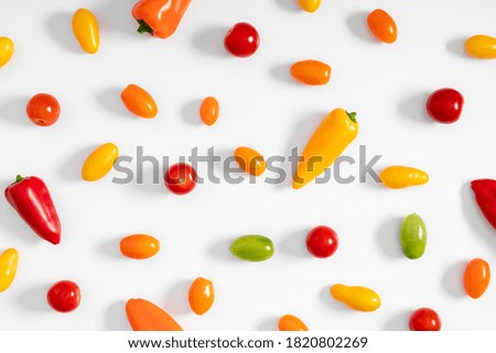 Vegetable on white background. Peppers and tomato as background. Flat lay, top view, copy space