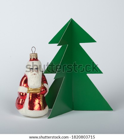 santa claus with gifts and christmas tree