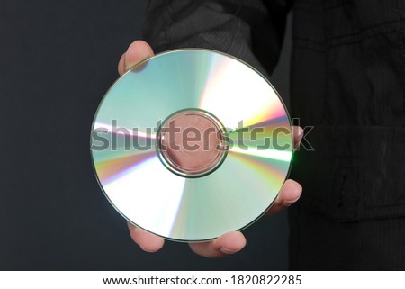 CD or DVD. Black Background.