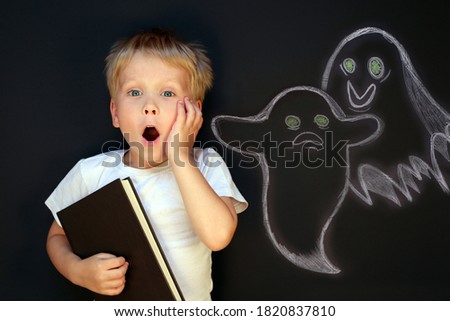 Scared child boy is afraid of ghosts. Childhood fears concept	