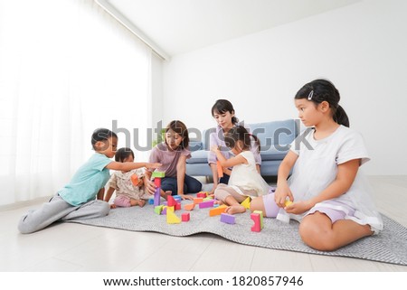 Moms and children playing at home