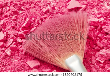 Make up brush with pink make up powder
