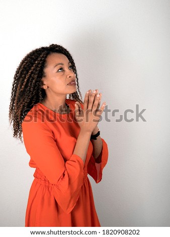 Vertical portrait of African American woman praying