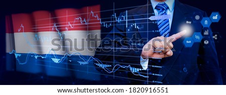 Businessman touching data analytics process system with KPI financial charts, dashboard of stock and marketing on virtual interface. With Netherlands flag in background.