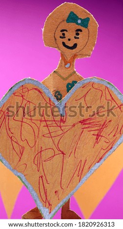 paper girl with a heart on pink background