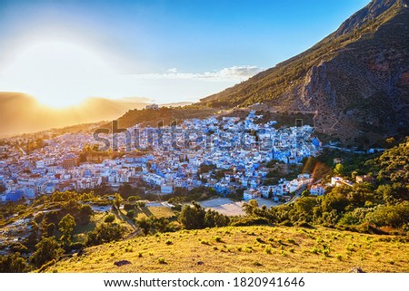 Aerial view of Chefchaouen in Morocco. The city is noted for its buildings in shades of blue and that makes Chefchaouen very attractive to visitors. Royalty-Free Stock Photo #1820941646