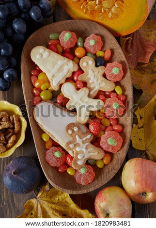 halloween sweets on dark wooden surface