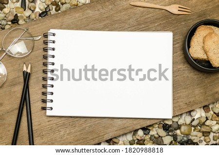 A blank white note book for background.