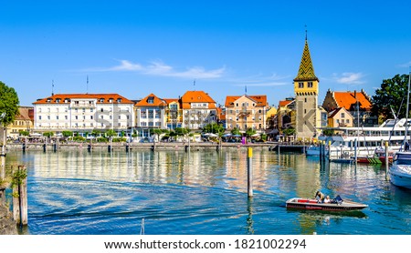 famous harbor with sailboats at the historic island of Lindau am Bodensee - Germany Royalty-Free Stock Photo #1821002294