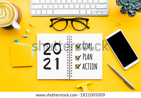 2021 new year goal,plan,action concepts with text on notepad and office accessories.Business management,Inspiration to success ideas Royalty-Free Stock Photo #1821005009