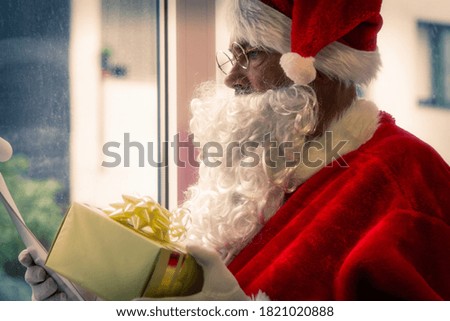 santa claus making christmas gift list, merry christmas postcard