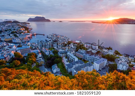 Colorful sunset in Alesund port town on western coast of Norway. Place where the ocean meet the mountains. Landscape photography