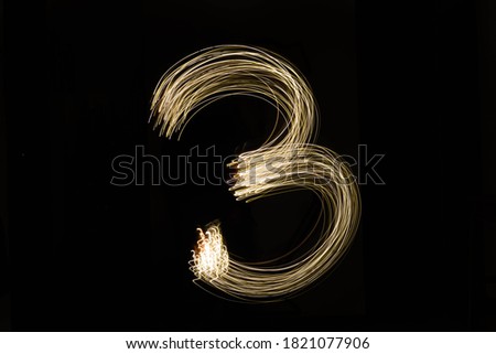 numbers drawn with led lights with dark black background for christmas and new year 2020 2021