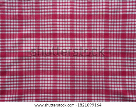 chequered red fabric texture useful as a background