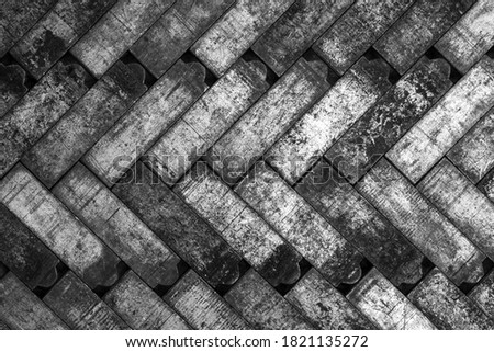 Monochrome mosaic metal tiles in fishbone pattern