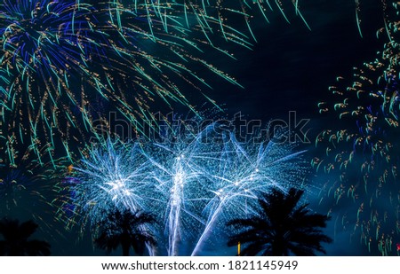 Background image with beautiful colorful firework texture background with different color of fireworks.