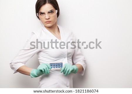 Close up of female doctor holding pill for men health