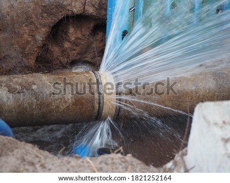 The main pipe is broken or burst pipe and is being repaired Royalty-Free Stock Photo #1821252164