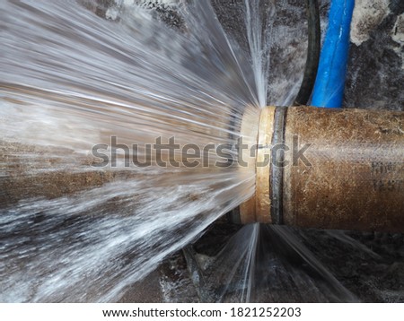 The main pipe is broken or burst pipe and is being repaired Royalty-Free Stock Photo #1821252203