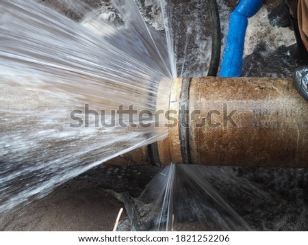 The main pipe is broken or burst pipe and is being repaired Royalty-Free Stock Photo #1821252206