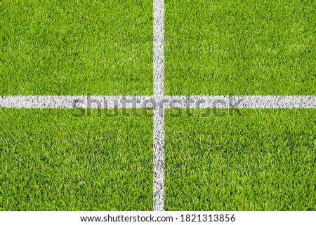 Top view of the white Line marking on the artificial green grass soccer field. 