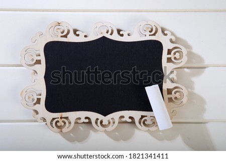   Mini blackboard chalkboard with copy space, isolated on white table top             
